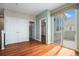 Bedroom featuring hardwood floors, closet, balcony access, and fresh paint at 375 Josephine St # D, Denver, CO 80206