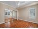 Bedroom with ceiling fan, hardwood floors, large mirrored closet, and neutral paint at 375 Josephine St # D, Denver, CO 80206