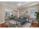 Staged bedroom with ceiling fan, hardwood floors, and a large mirrored closet at 375 Josephine St # D, Denver, CO 80206