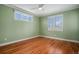 Empty bedroom featuring hardwood floors, windows, and neutral paint, offering versatility at 375 Josephine St # D, Denver, CO 80206