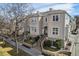 Charming exterior view with manicured front yard, brick accents, and a welcoming entrance at 375 Josephine St # D, Denver, CO 80206