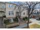 Charming exterior view with manicured front yard, brick accents, and a welcoming entrance at 375 Josephine St # D, Denver, CO 80206