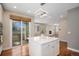 Bright kitchen featuring a center island, modern lighting, and a sliding door to the balcony at 375 Josephine St # D, Denver, CO 80206