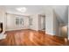 Bright living room featuring hardwood floors, plantation shutters, and modern lighting near the entry at 375 Josephine St # D, Denver, CO 80206