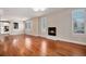 Bright living room featuring hardwood floors, fireplace, and plantation shutters, with an open layout at 375 Josephine St # D, Denver, CO 80206