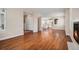 Bright living room featuring hardwood floors, fireplace, and plantation shutters at 375 Josephine St # D, Denver, CO 80206