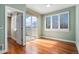 Home office features hardwood floors, natural light, and access to balcony at 375 Josephine St # D, Denver, CO 80206