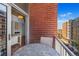 Urban balcony with seating for two at 1700 Bassett St # 502, Denver, CO 80202