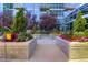 Landscaped courtyard with colorful flowers and seating areas at 1700 Bassett St # 502, Denver, CO 80202