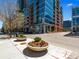 Modern building with street-level retail and landscaping at 1700 Bassett St # 502, Denver, CO 80202