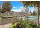 Community rooftop pool with surrounding lounge chairs and city views at 1700 Bassett St # 502, Denver, CO 80202