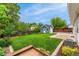 Spacious backyard featuring a shed, green lawn, mature trees, and room for various activities at 13483 Alcott Way, Broomfield, CO 80020