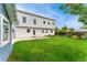 Lush backyard with a large lawn and access to both the main house and the shed at 13483 Alcott Way, Broomfield, CO 80020