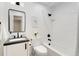 Modern bathroom with subway tile, black fixtures, and sleek vanity at 13483 Alcott Way, Broomfield, CO 80020