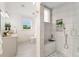 Bright bathroom with tiled shower and vanity offers a modern and serene space at 13483 Alcott Way, Broomfield, CO 80020