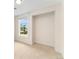 Bright bedroom with neutral carpet features built-in shelving and a view from the window at 13483 Alcott Way, Broomfield, CO 80020