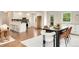 Open floor plan showcases a dining area leading into a kitchen and additional living space at 13483 Alcott Way, Broomfield, CO 80020