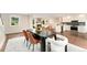 Dining room with modern table set connects to kitchen and living spaces at 13483 Alcott Way, Broomfield, CO 80020