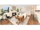 Comfortable living room featuring a fireplace, hardwood floors, and a stylish seating arrangement for relaxation at 13483 Alcott Way, Broomfield, CO 80020