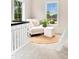 Cozy loft nook features a chair, ottoman, and jute rug, perfect for relaxation with natural light at 13483 Alcott Way, Broomfield, CO 80020