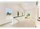 Bright loft area with vaulted ceilings, neutral tones, and large windows offers a cozy retreat at 13483 Alcott Way, Broomfield, CO 80020