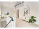 Loft area with modern decor, ladder, and views of the downstairs living space at 13483 Alcott Way, Broomfield, CO 80020