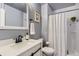 Modern bathroom featuring a sink with matte black hardware, framed mirror and a walk-in shower at 10779 Longs Way, Parker, CO 80138