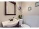 Charming half bathroom featuring new fixtures, decor and elegant finishes at 10779 Longs Way, Parker, CO 80138