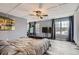 Bright bedroom features many windows, soft gray walls, ceiling fan, and a comfortable atmosphere at 10779 Longs Way, Parker, CO 80138