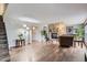 Spacious living room with hardwood floors and a stone fireplace, perfect for relaxing and entertaining guests at 10779 Longs Way, Parker, CO 80138