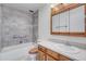Bathroom with tub, shower, and wood vanity at 3082 S Wheeling Way # 408, Aurora, CO 80014