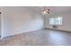 Bright bedroom with ceiling fan and large window at 3082 S Wheeling Way # 408, Aurora, CO 80014
