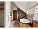 Luxurious bathroom featuring a modern soaking tub, stone accents, and a separate shower at 3445 S Clermont St, Denver, CO 80222