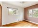 Neutral bedroom with wood floors, white and taupe walls, and sunny windows at 3445 S Clermont St, Denver, CO 80222