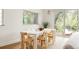 Bright dining room with modern table and chairs, and large windows at 3445 S Clermont St, Denver, CO 80222