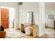 Welcoming entryway featuring a wooden door, stylish console table, and decorative accents at 3445 S Clermont St, Denver, CO 80222