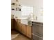 Modern kitchen with farmhouse sink, white countertops, and stainless steel appliances at 3445 S Clermont St, Denver, CO 80222