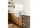 Bright kitchen features white countertops, wood cabinets, and a stainless steel dishwasher at 3445 S Clermont St, Denver, CO 80222