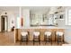 Modern kitchen with a large island, stylish stools, and ample storage, perfect for culinary enthusiasts and casual dining at 3445 S Clermont St, Denver, CO 80222