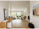 Sun-filled living room with hardwood floors, large windows, and open floor plan at 3445 S Clermont St, Denver, CO 80222
