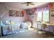 Bright bedroom with a window desk area, offering a comfortable space for relaxation and study at 1120 Brenthaven Ct, Monument, CO 80132