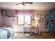Comfortable bedroom with a cozy decor and a well-lit desk area, perfect for study or work at 1120 Brenthaven Ct, Monument, CO 80132