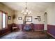 Traditional dining room with hardwood floors, chair rail detail, and a stylish chandelier, perfect for entertaining at 1120 Brenthaven Ct, Monument, CO 80132