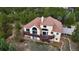 Stunning aerial view of home featuring a brown roof, stucco exterior, and a spacious deck at 1120 Brenthaven Ct, Monument, CO 80132