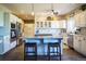 Well-appointed kitchen featuring granite countertops, stainless steel appliances, a center island and wood flooring throughout at 1120 Brenthaven Ct, Monument, CO 80132