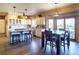 Spacious eat-in kitchen featuring a center island, granite countertops, stainless appliances, and an adjoinging patio with mountain views at 1120 Brenthaven Ct, Monument, CO 80132