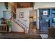 Spacious living area featuring a fireplace, open staircase, and a seamless flow into other parts of the home at 1120 Brenthaven Ct, Monument, CO 80132