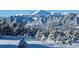 Idyllic mountain vista with snow-covered trees framing the snow-capped mountain range at 1120 Brenthaven Ct, Monument, CO 80132