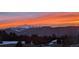 Breathtaking sunset view of majestic mountains, with fiery sky reflecting on snowy peaks at 1120 Brenthaven Ct, Monument, CO 80132