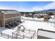 Exterior aerial view of a home in winter, showing surrounding neighborhood and snow-covered landscaping at 19814 Lindenmere Dr, Monument, CO 80132